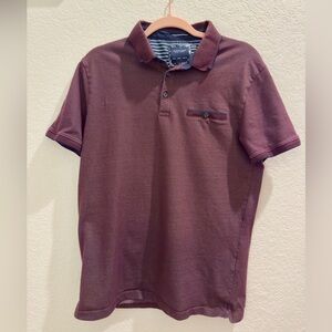 Cactus Man Ricky Singh burgundy polo shirt.